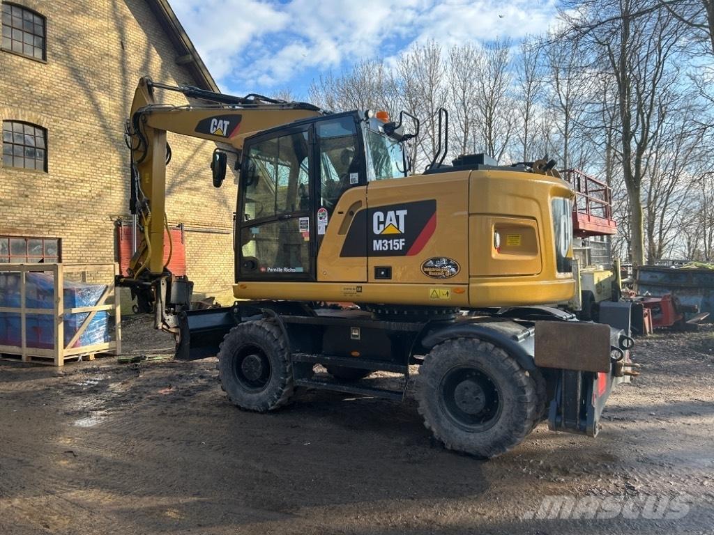 CAT M315F Ekskavatori uz riteņiem