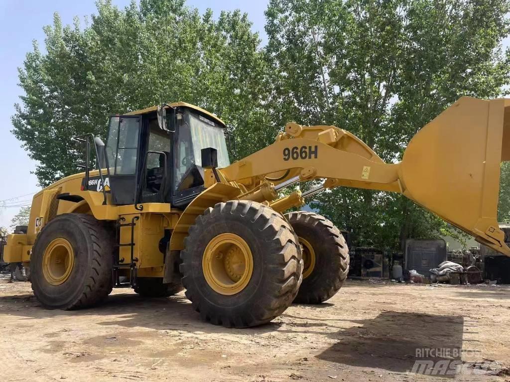CAT 966 Ekskavatori uz riteņiem