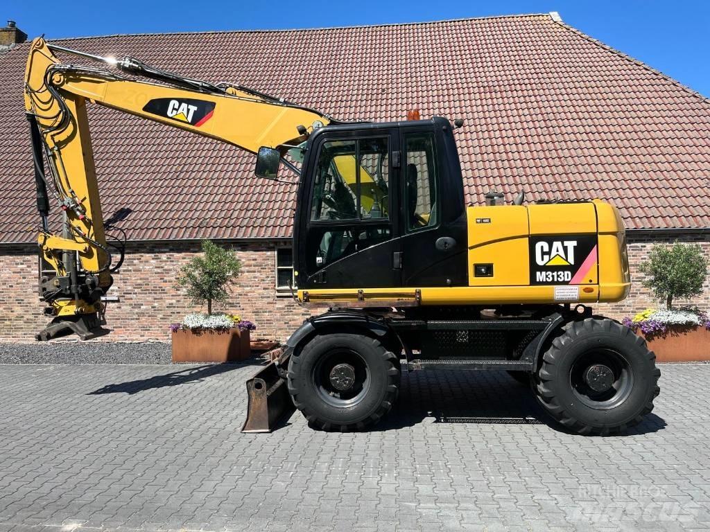 CAT M 313 D Ekskavatori uz riteņiem