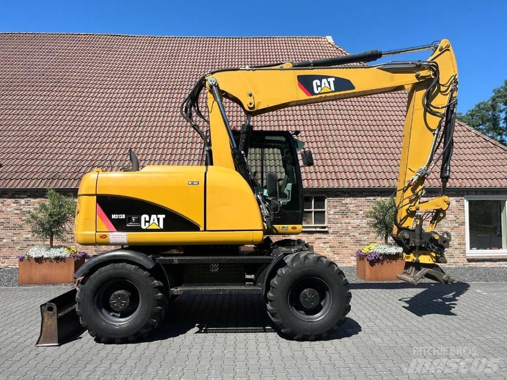 CAT M 313 D Ekskavatori uz riteņiem