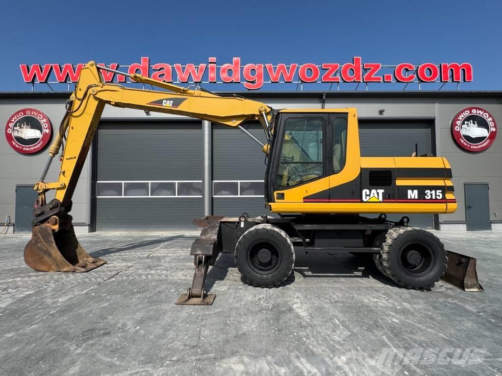 CAT M 315 Ekskavatori uz riteņiem