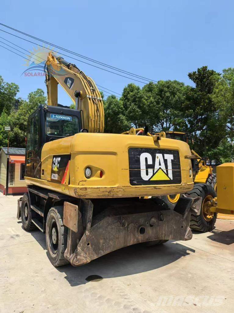CAT M 320D2 Ekskavatori uz riteņiem