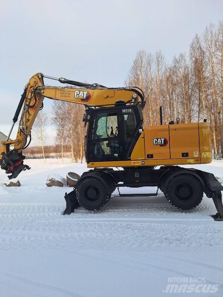 CAT M 318 Ekskavatori uz riteņiem