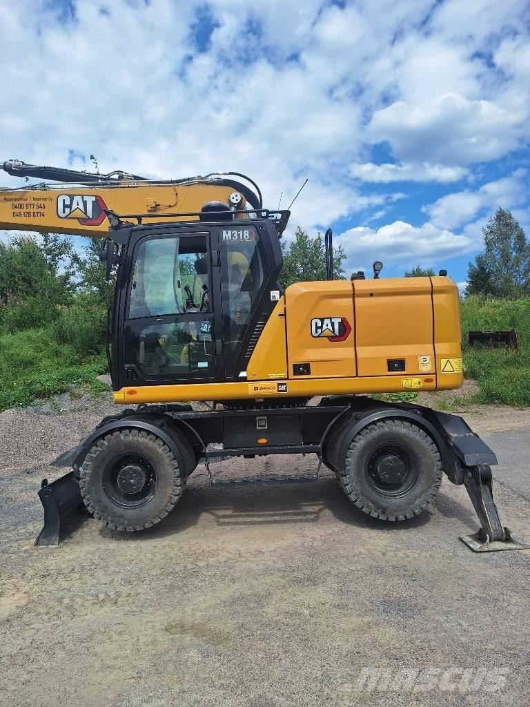 CAT M 318 Ekskavatori uz riteņiem