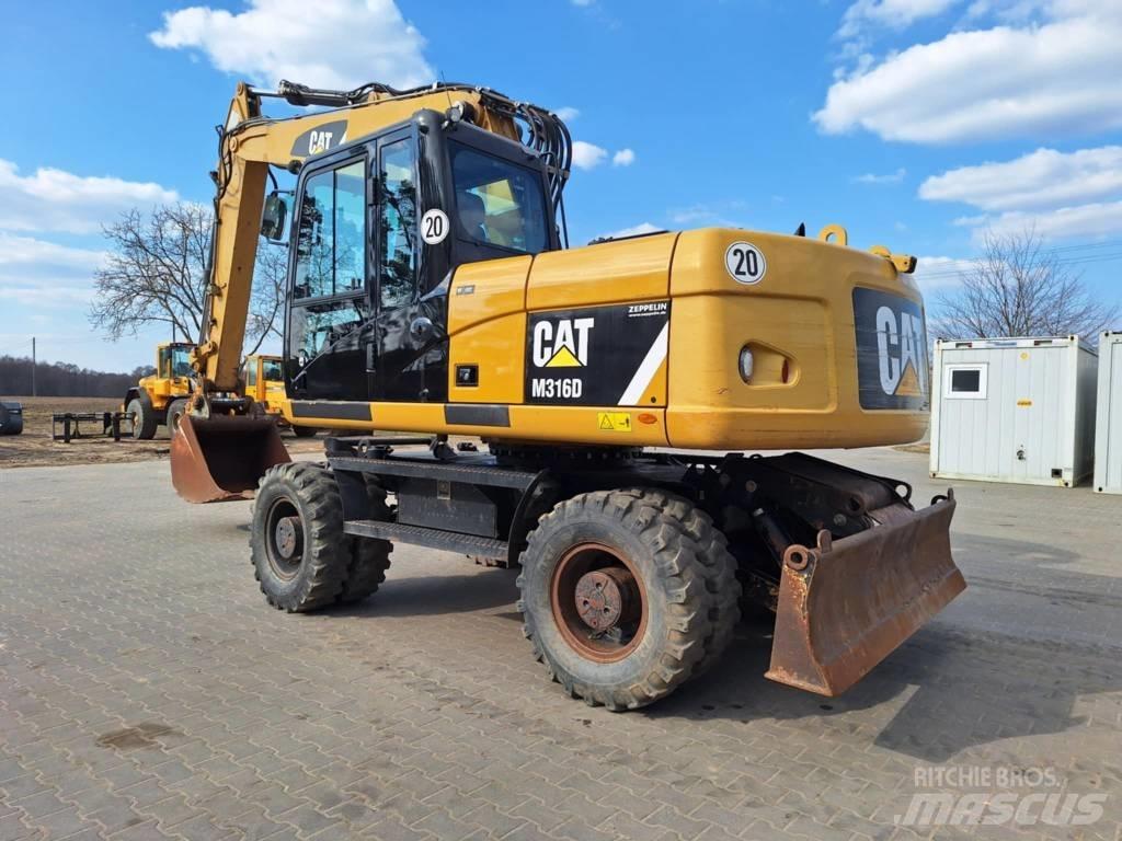 CAT M 316 D Ekskavatori uz riteņiem