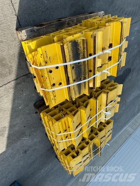 Komatsu d 85 plate Sliedes, ķēdes un šasija