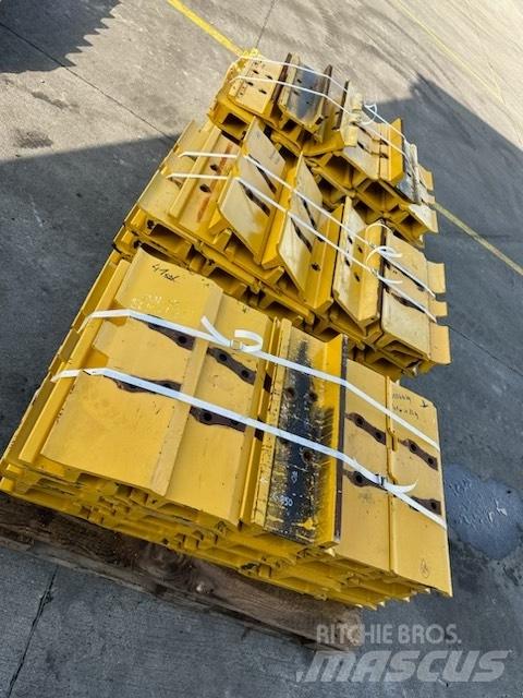 Komatsu d 85 plate Sliedes, ķēdes un šasija