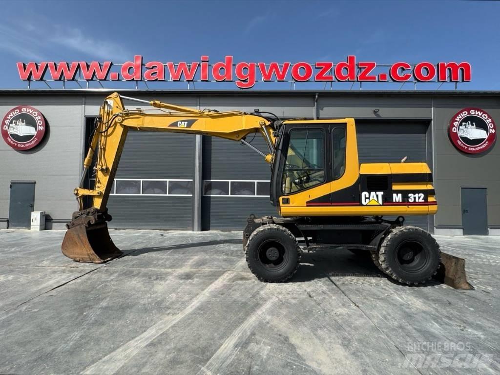 CAT M 312 Ekskavatori uz riteņiem