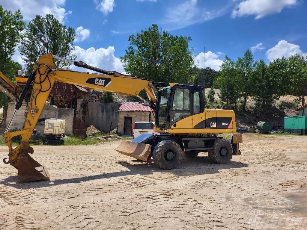 CAT 316d Ekskavatori uz riteņiem