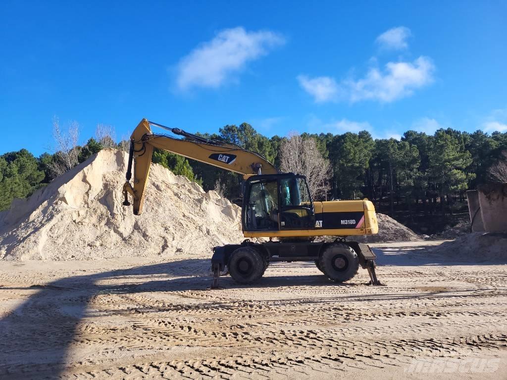 CAT 316d Ekskavatori uz riteņiem