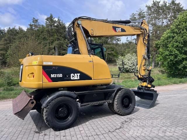 CAT M 315 D Ekskavatori uz riteņiem
