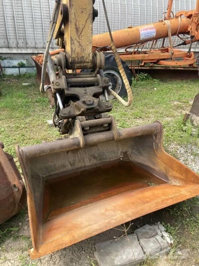 CAT M 312 Ekskavatori uz riteņiem