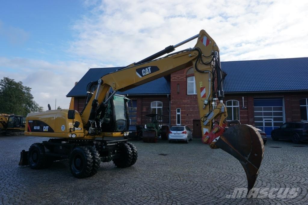 CAT M 318 D Ekskavatori uz riteņiem