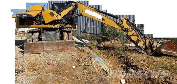 CAT M 313 D Ekskavatori uz riteņiem