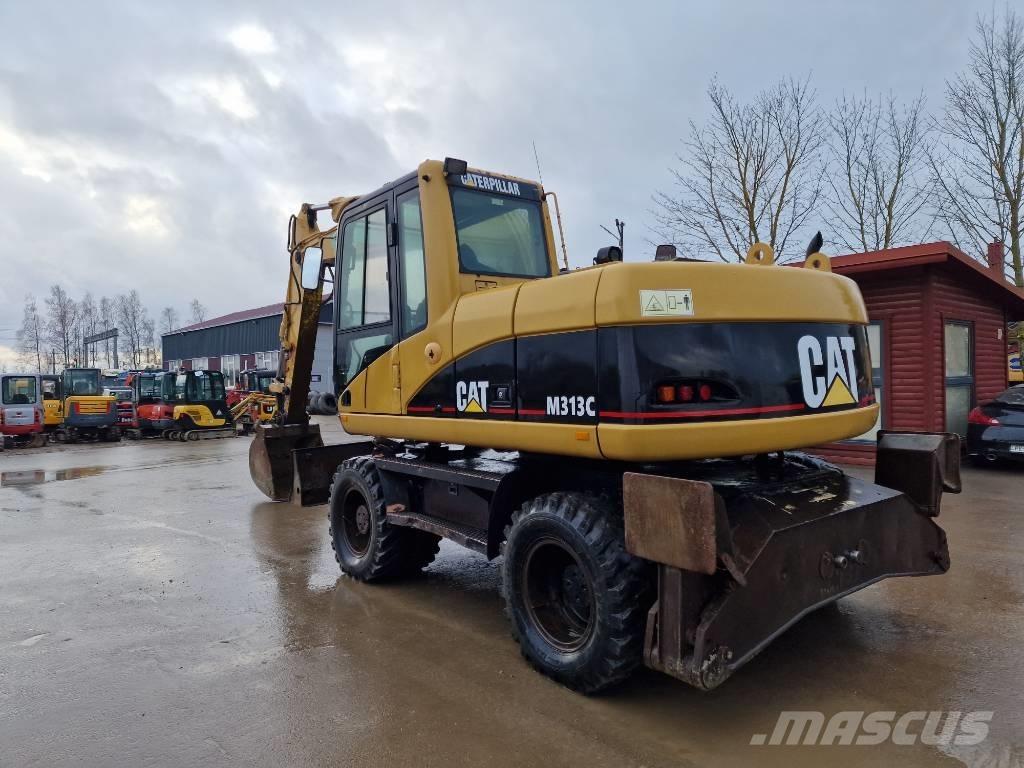 CAT M 313 C Ekskavatori uz riteņiem