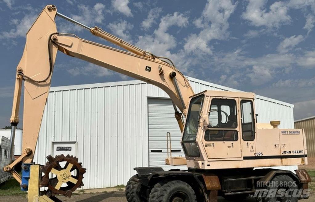 John Deere 595 Ekskavatori uz riteņiem
