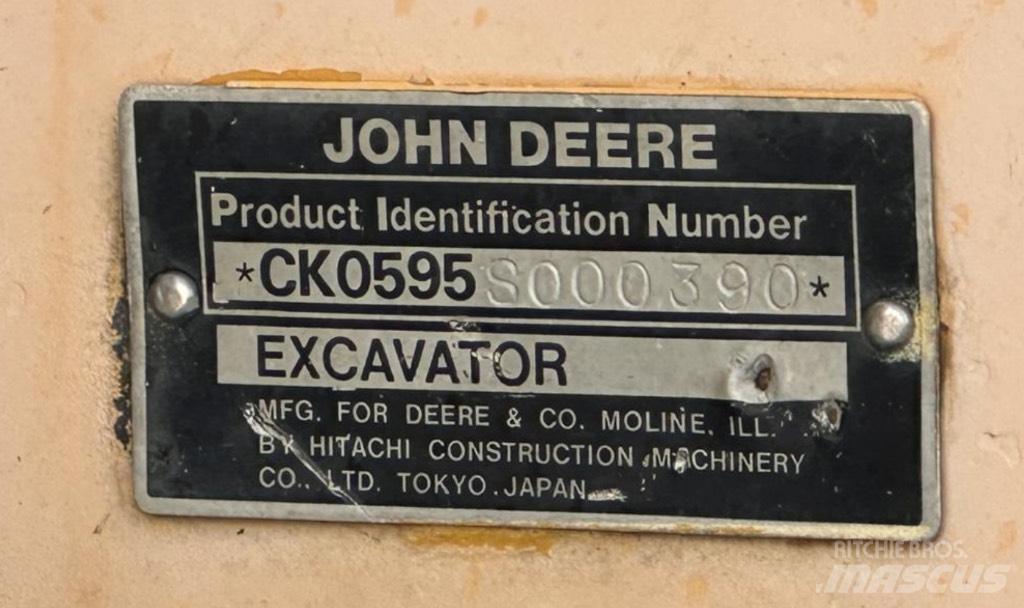 John Deere 595 Ekskavatori uz riteņiem