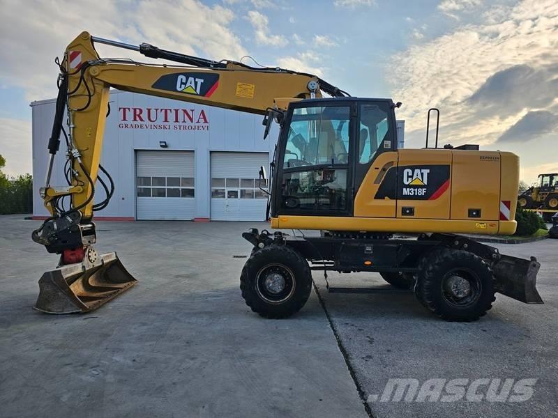 CAT M 318 F Ekskavatori uz riteņiem