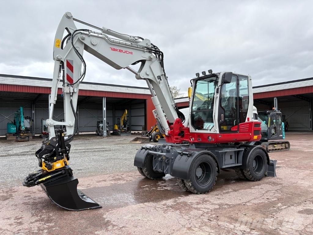 Takeuchi TB395W Ekskavatori uz riteņiem