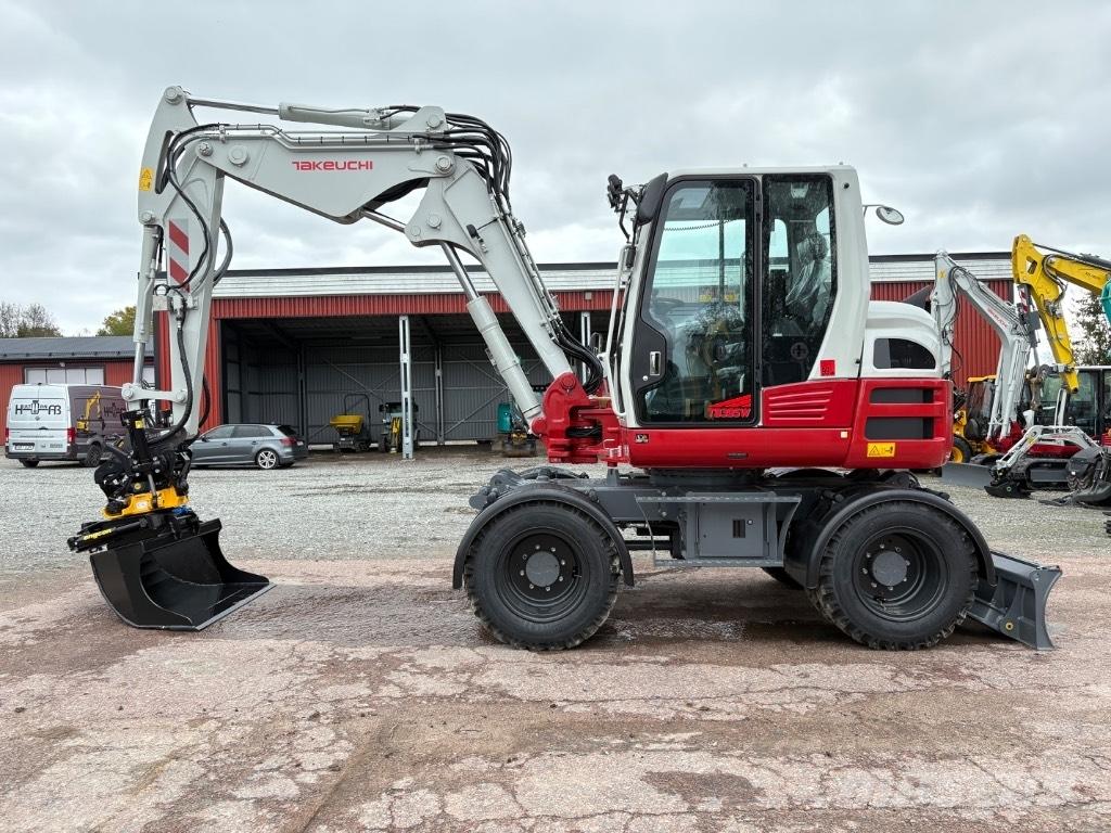 Takeuchi TB395W Ekskavatori uz riteņiem