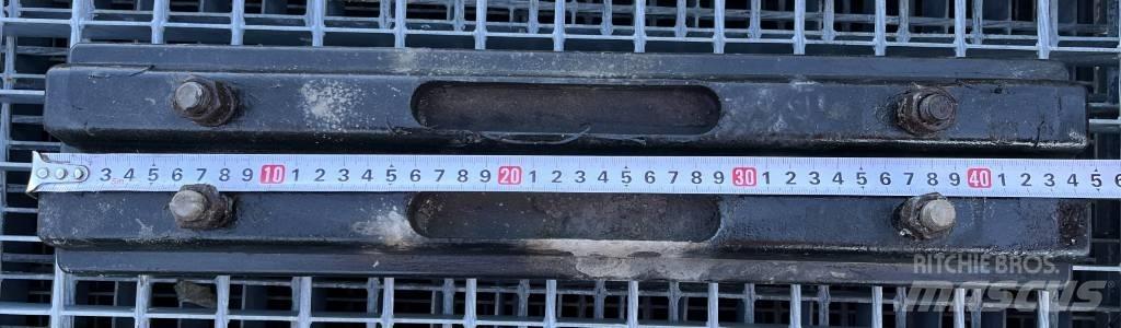  TXD 450A Sliedes, ķēdes un šasija