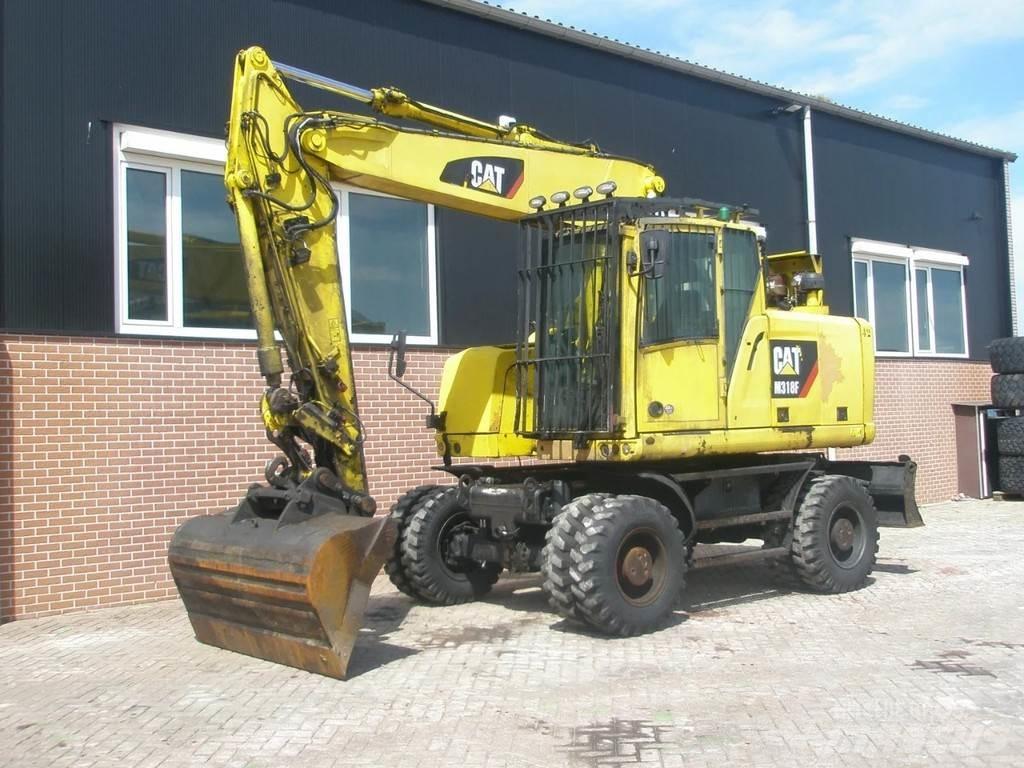 CAT M318F Ekskavatori uz riteņiem