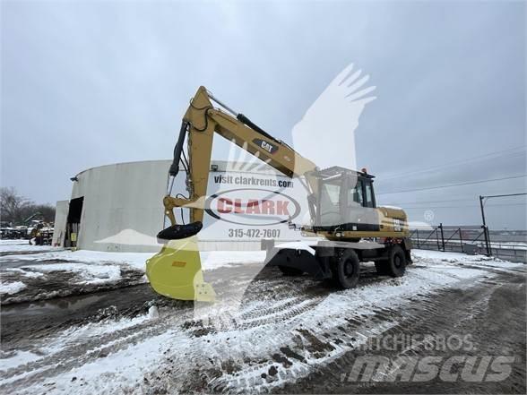 CAT M318D Ekskavatori uz riteņiem
