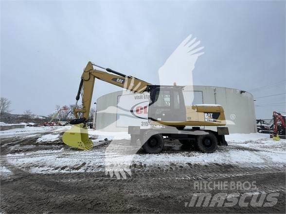 CAT M318D Ekskavatori uz riteņiem