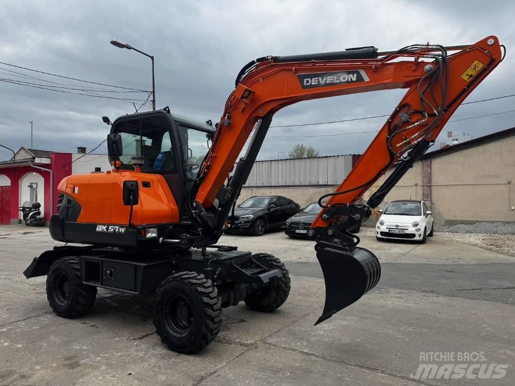 Develon DX 57 W-7 Ekskavatori uz riteņiem