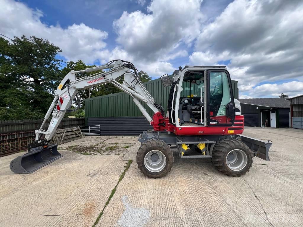Takeuchi 295w Ekskavatori uz riteņiem