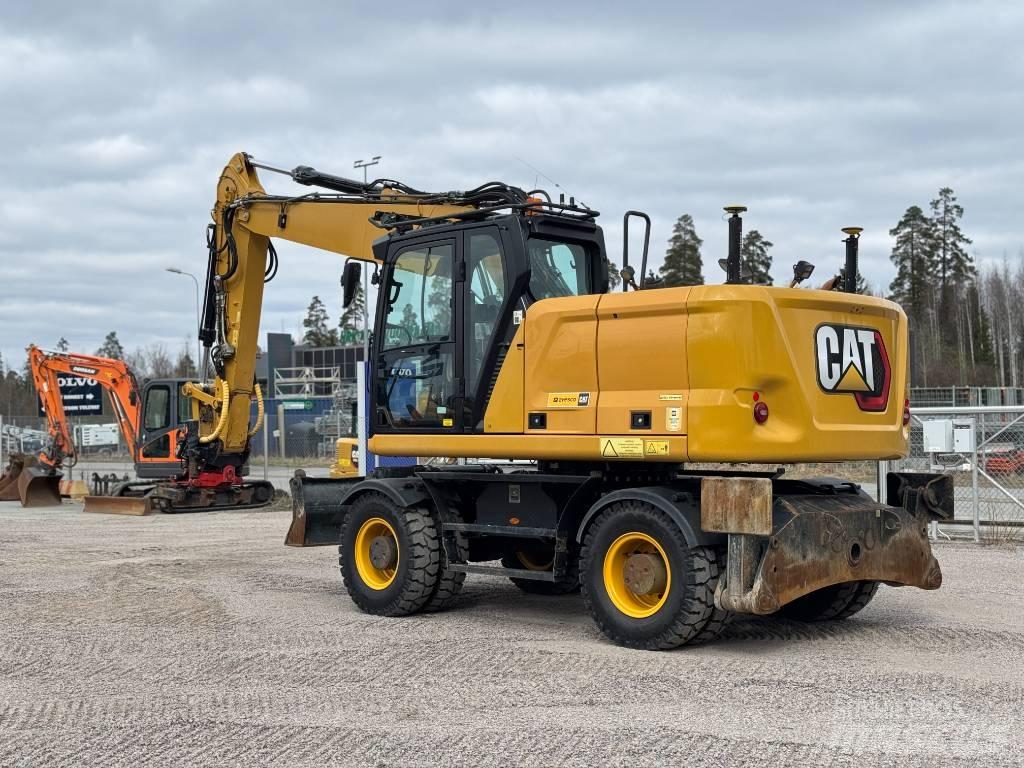 CAT M 318 Ekskavatori uz riteņiem