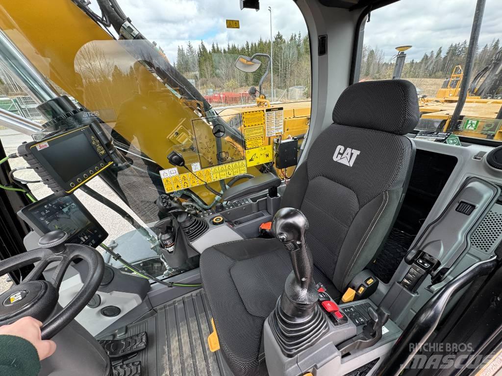 CAT M 318 Ekskavatori uz riteņiem