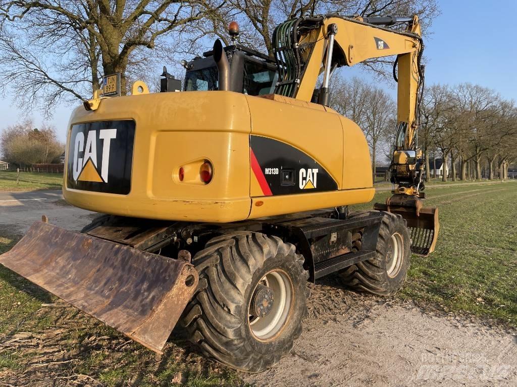 CAT M 313 D Ekskavatori uz riteņiem