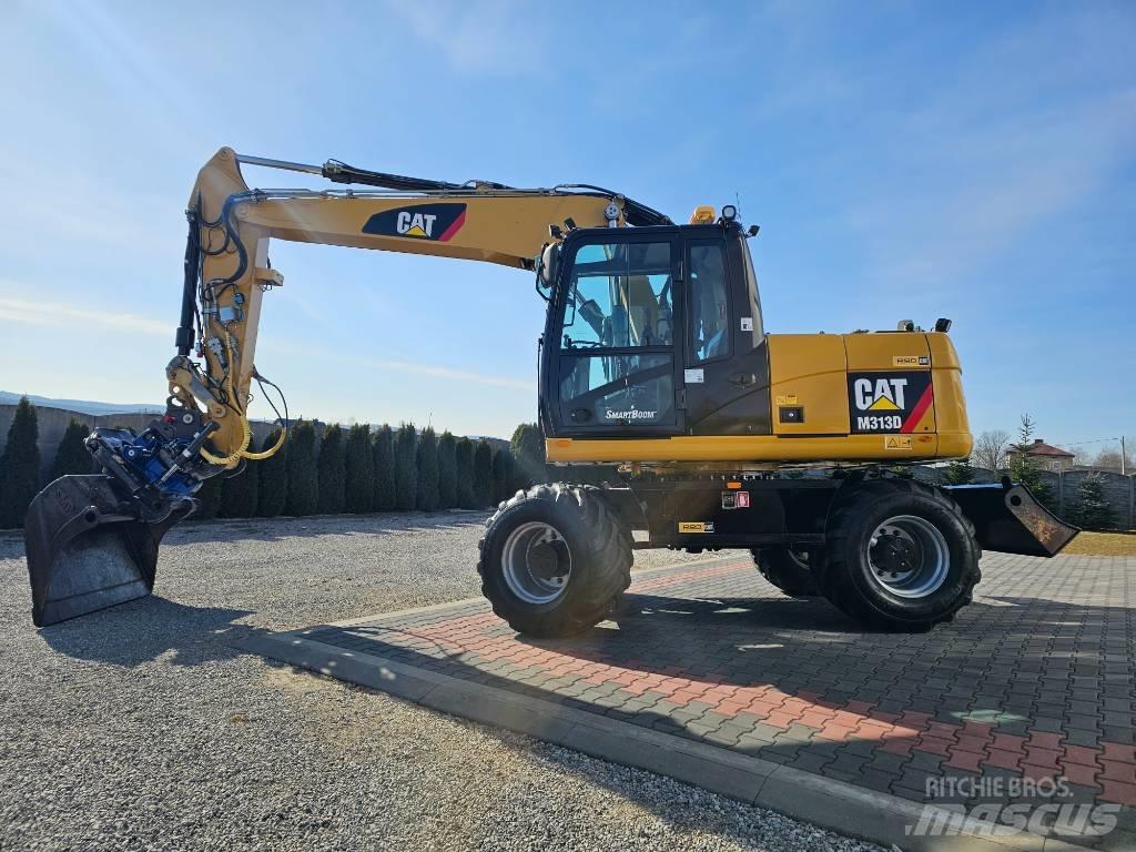 CAT M 313 D Ekskavatori uz riteņiem