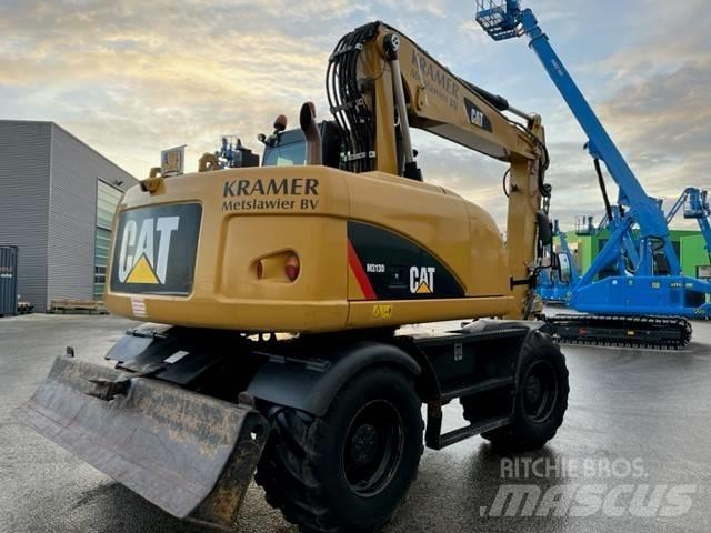 CAT M 313 D Ekskavatori uz riteņiem