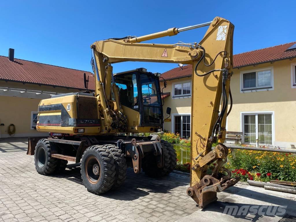 CAT M 312 Ekskavatori uz riteņiem