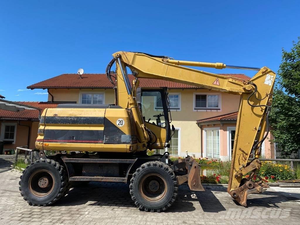 CAT M 312 Ekskavatori uz riteņiem
