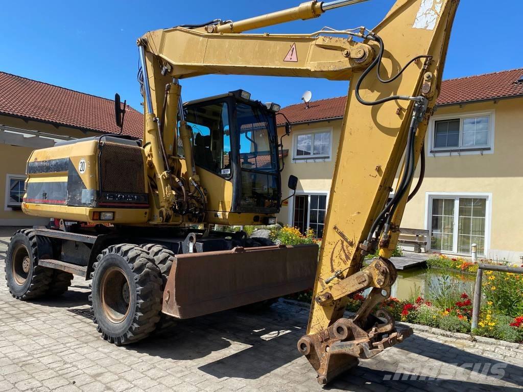 CAT M 312 Ekskavatori uz riteņiem