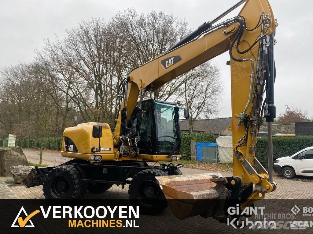 CAT M313D Ekskavatori uz riteņiem
