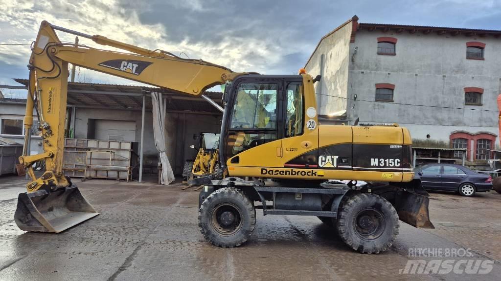 CAT M 315 C Ekskavatori uz riteņiem