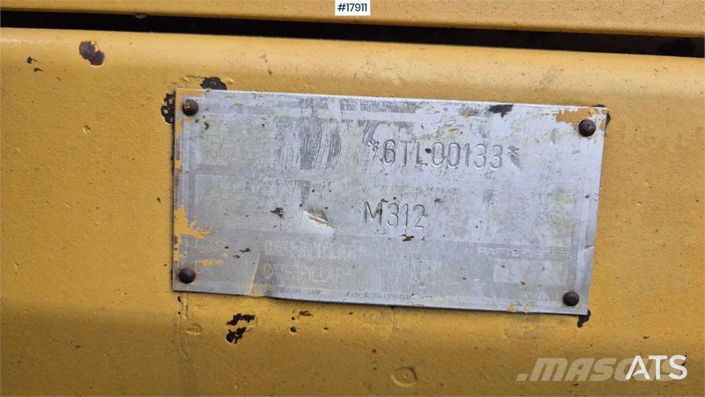 CAT M312 Ekskavatori uz riteņiem