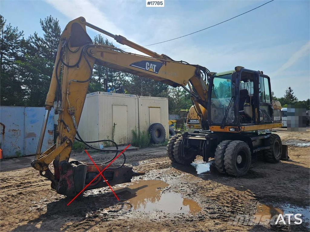 CAT M313 C Ekskavatori uz riteņiem