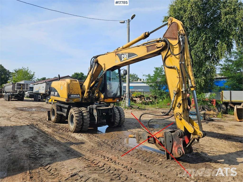 CAT M313 C Ekskavatori uz riteņiem