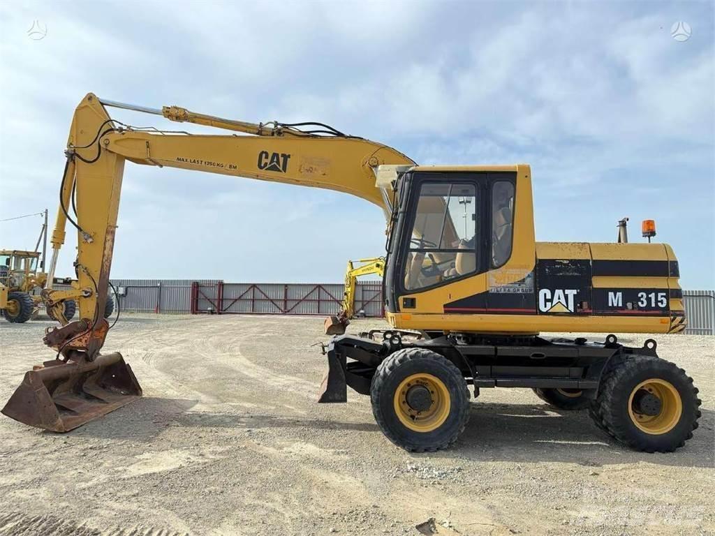 CAT M 315 Ekskavatori uz riteņiem
