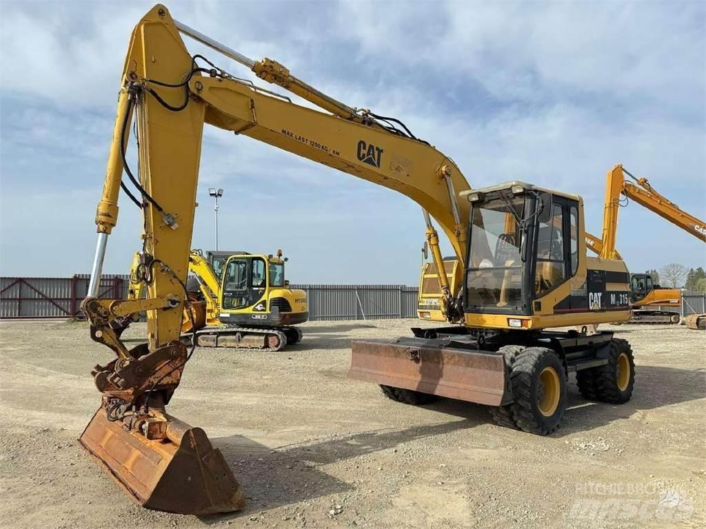 CAT M 315 Ekskavatori uz riteņiem