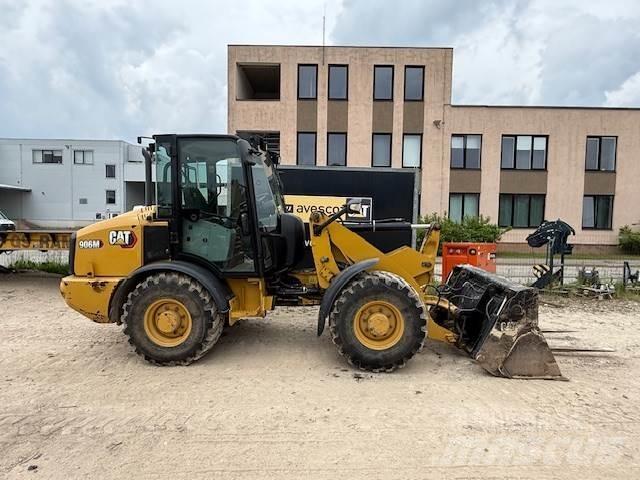 CAT 906 Iekrāvēji uz riteņiem