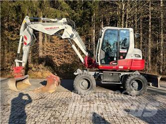 Takeuchi TB295W Ekskavatori uz riteņiem