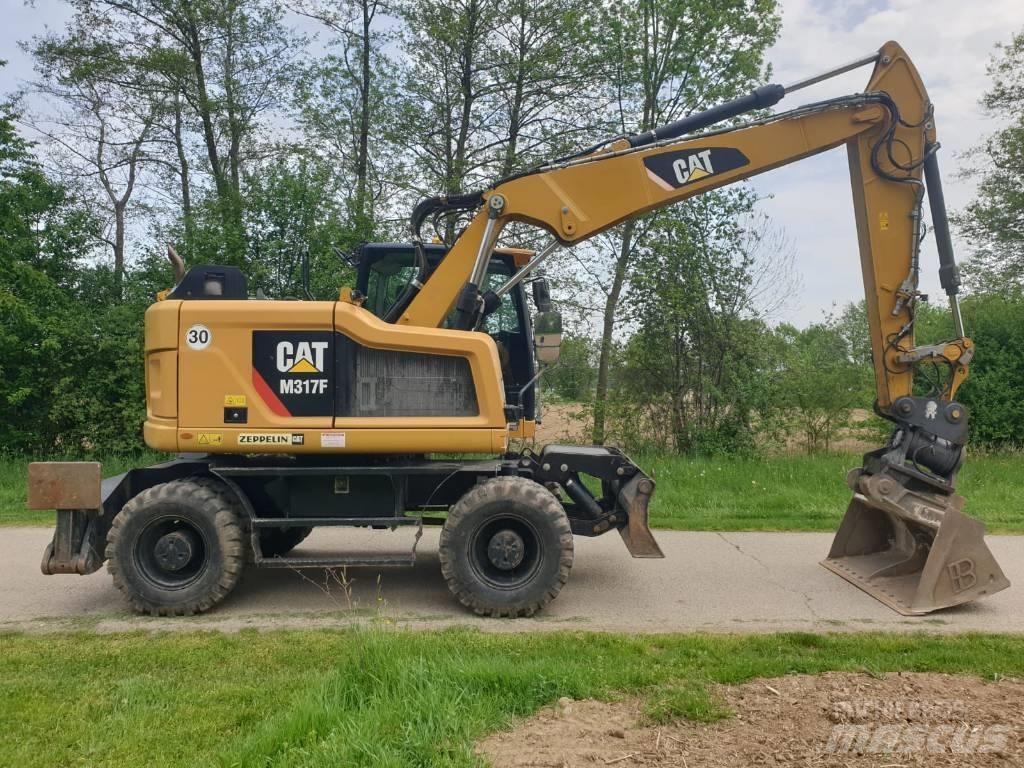 CAT M 317 F Ekskavatori uz riteņiem