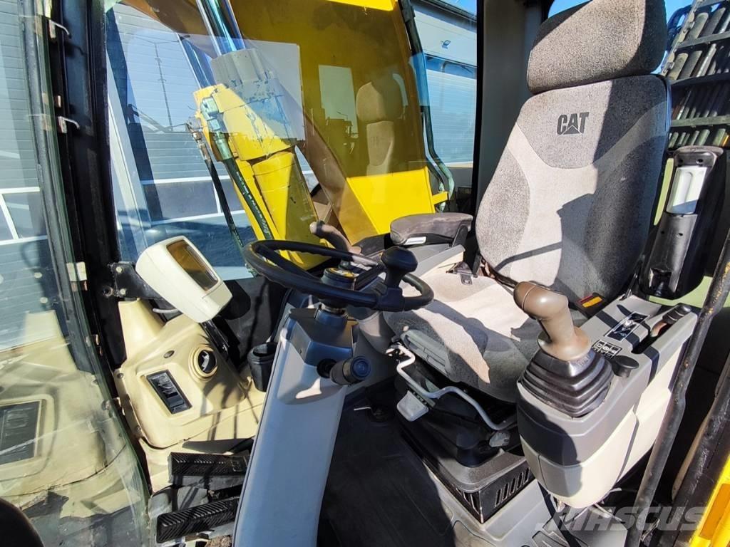 CAT M 318 C Ekskavatori uz riteņiem