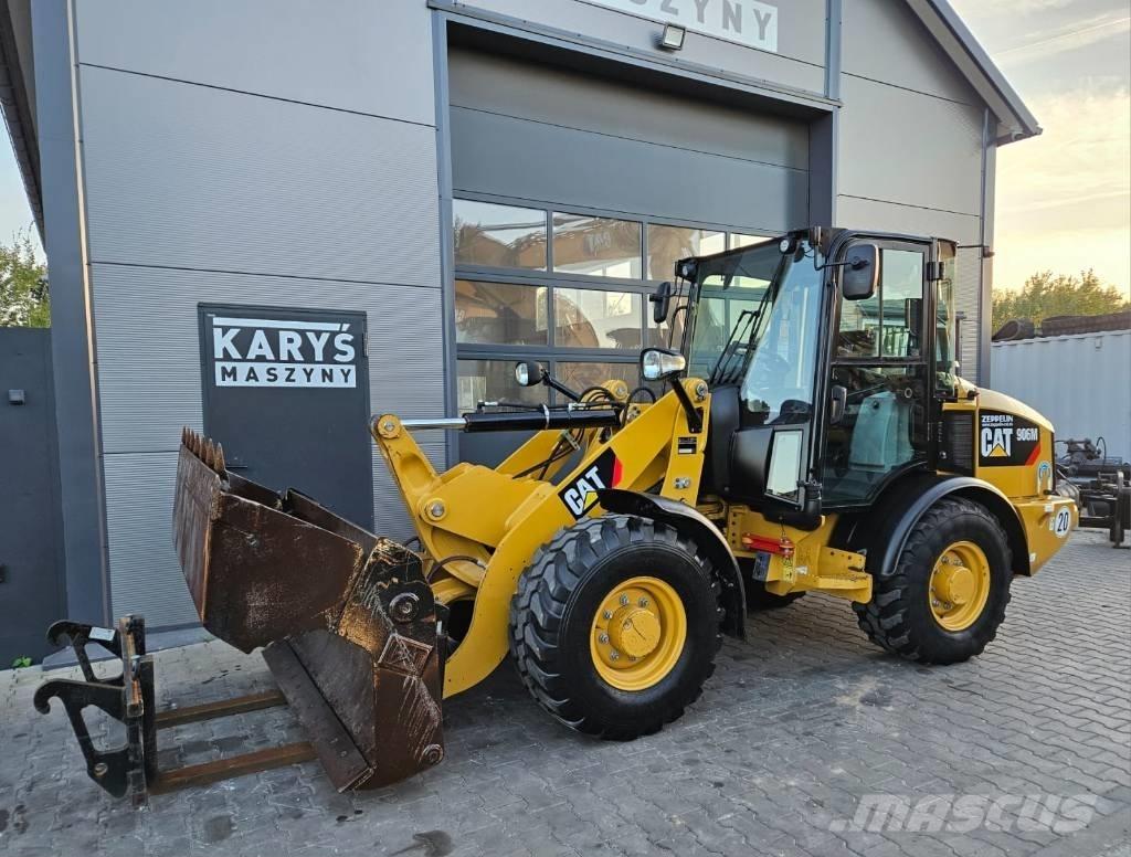 CAT 906 Iekrāvēji uz riteņiem